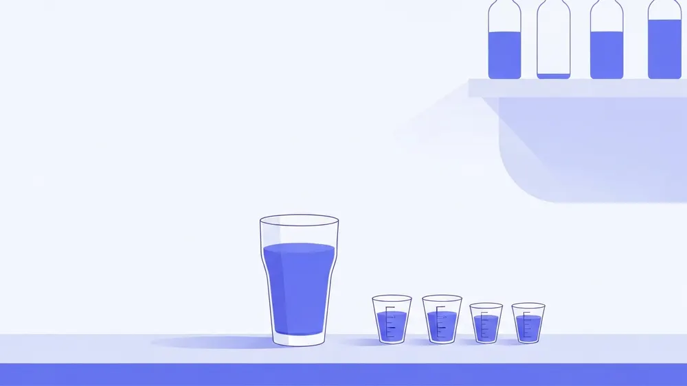 A pint glass lined up against sixteen small one ounce measures
